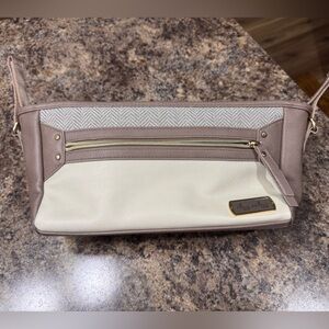 Itzy Ritzy Cream and Tan stroller storage